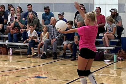 Pearce Volleyball Express Girl Serving with Crowd